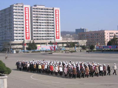 Korean workers practice marching outside the Korean War Museum